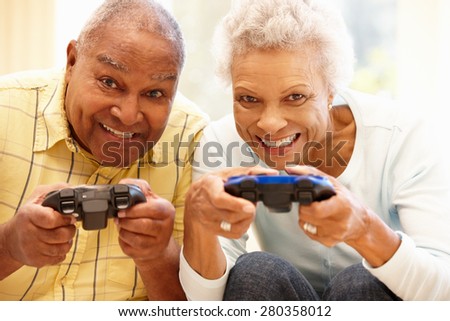 Senior couple playing computer games