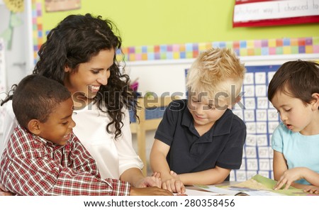 Group Of Elementary Age Schoolchildren In Class With Teacher
