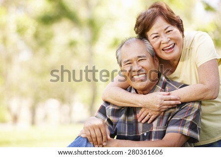 Portrait senior Asian couple in park