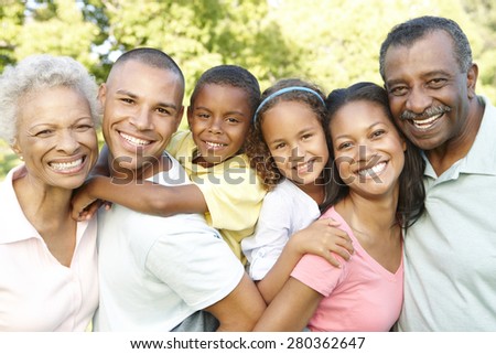 Multi Generation African American Family Relaxing In Park