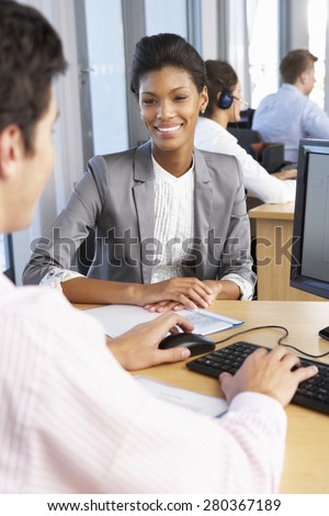 New Employee Starting Work In Busy Office
