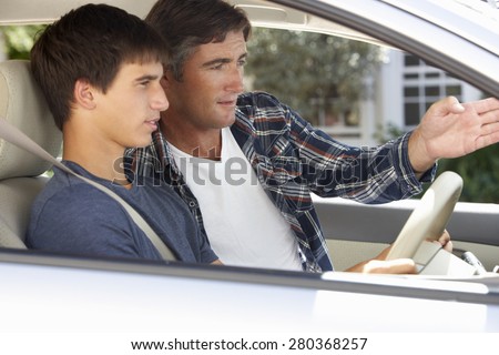 Father Teaching Teenage Son To Drive