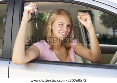 Teenage Girl Celebrating Owning First Car