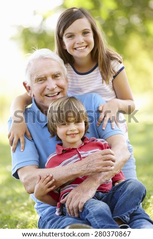 Senior man and grandchildren in park