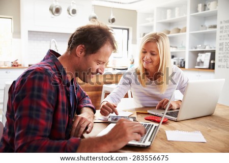Man and woman working together at home