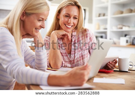 Two women working together at home