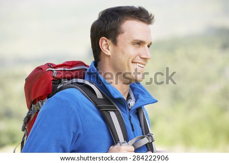 Portrait Of Man On Hike In Beautiful Countryside