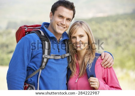 Portrait Of Couple On Hike In Beautiful Countryside