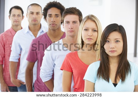 Line Of Young Business People In Casual Dress