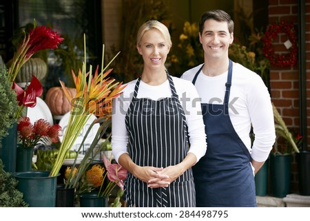 Portrait Of Male And Female Florist Outside Shop
