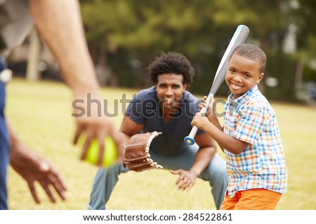 Grandfather With Son And Grandson Playing Baseball