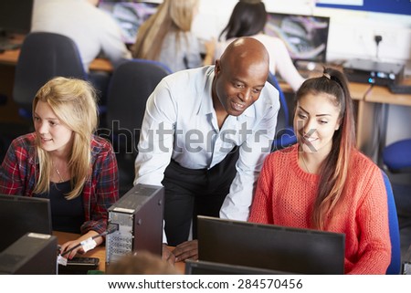 College Students At Computers In Technology Class