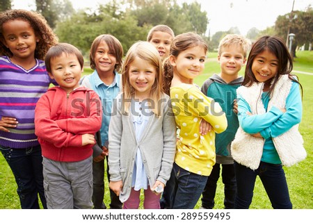 Group Of Young Children Hanging Out In Park