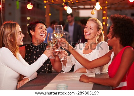 Girlfriends at rooftop party