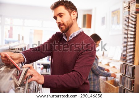Man selecting records at record shop