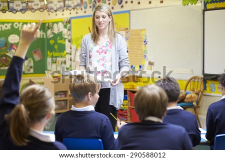 Teacher Teaching Lesson To Elementary School Pupils