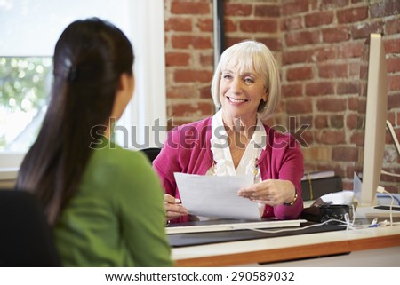 Businesswoman Interviewing Female Job Applicant In Office