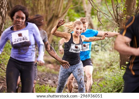 Competitors enjoying a run in a forest at an endurance event