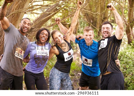 Competitors celebrate completing an endurance sports event