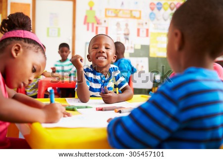 Preschool class in South Africa, boy looking to camera