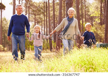 Grandparents and grandchildren walking in the countryside