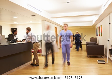 Busy Nurse\'s Station In Modern Hospital