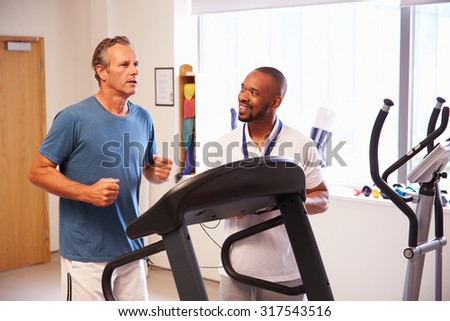 Patient Using Treadmill In Hospital Physiotherapy Department
