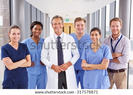 Portrait Of Medical Team Standing In Hospital Corridor