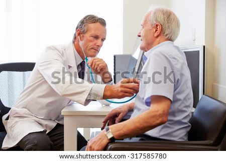 Senior Patient Having Medical Exam With Doctor In Office