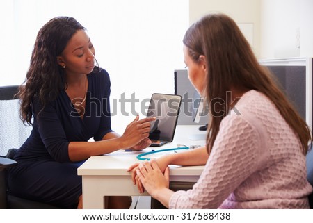 Patient Having Consultation With Female Doctor In Office
