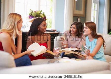 Group Of Female Friends Taking Part In Book Club At Home