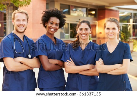 Portrait Of Medical Team Standing Outside Hospital