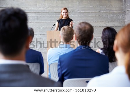 Businesswoman Addressing Delegates At Conference