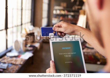 Credit Card Reading Device Attached To Digital Tablet