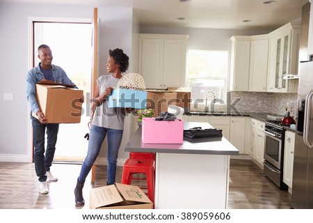 Young Couple Moving In To New Home Together