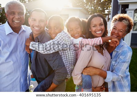 Black multi generation family outside, backlit portrait