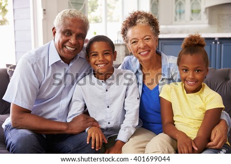 Grandparents and their young grandchildren at home, portrait