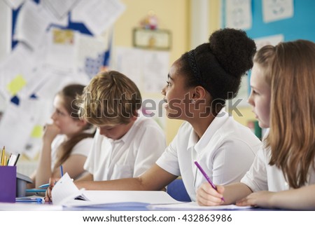 A row of primary school children in class, close up