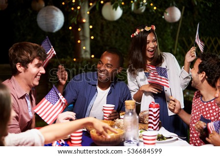 Friends Celebrating 4th Of July Holiday With Backyard Party