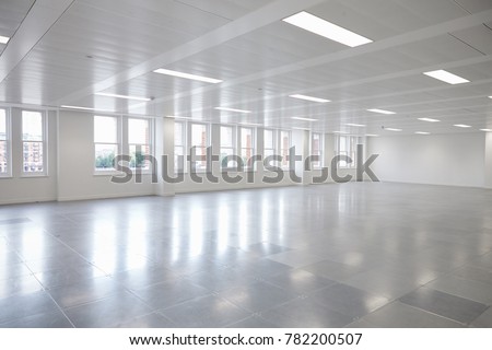 Vacant open plan office space with windows