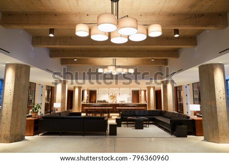 Empty bar lounge area in modern business premises, wide shot