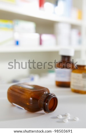 Prescription pill bottles on pharmacy shelf