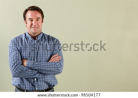 Studio Shot Of Relaxed Middle Aged Man