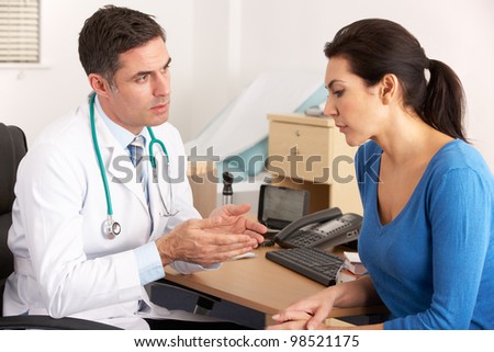 American doctor talking to woman in surgery