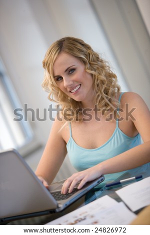 woman,working or surfing with laptop at home.Concept of e-learning or surfing while at home