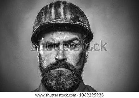 Portrait mechanical worker. Bearded man in suit with construction helmet. Portrait of handsome engineer. Construction worker in hardhat. Business, industry, technology - builder concept. Black&white.