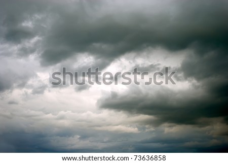 dark gray dramatic sky with large clouds