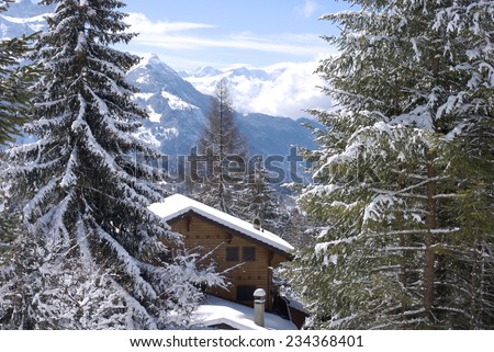 Holiday chalet in winter in the swiss Alps
