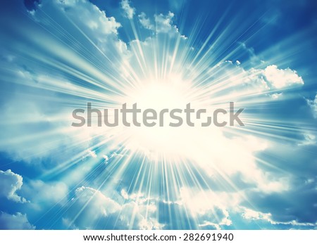 Sun in the blue sky with clouds. Brightly sunlight. Sunny day. Freedom solar concept