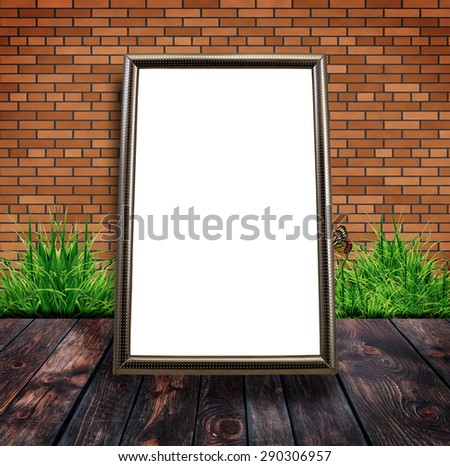 Blank white board wood frame on wooden floor and brick wall. Template blank poster mock up for adding your design and text. Fresh spring green grass